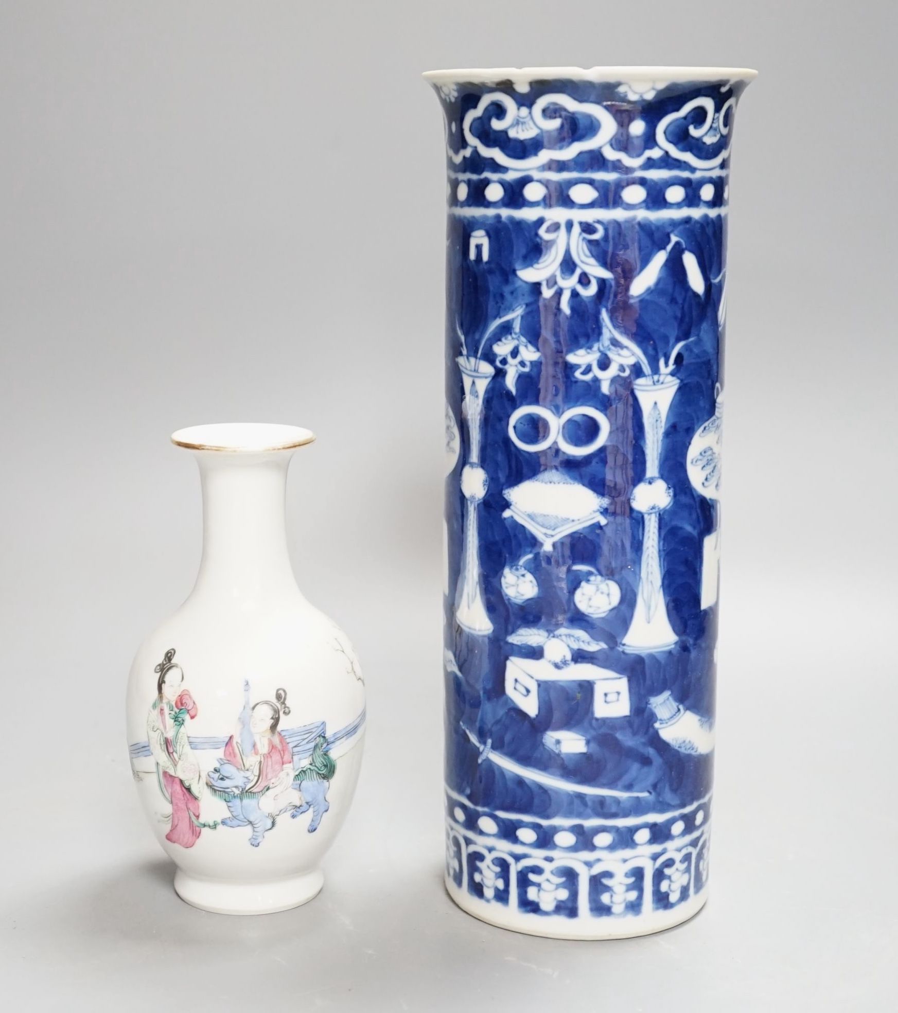 A Chinese blue and white sleeve vase and small famille rose vase, sleeve vase 25 cms high.